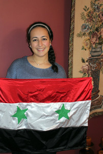 Jasmin Dieb, a senior at HHS, is proud of her Syrian heritage. The country's flag is representative of her and her culture. The black represents the oppression Syria faced, the red represents the blood of those who fought, and the white represents peace and hope for a better future. Photo by Cassandra Boyce