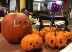 The Hopkinton High School library displayed some of the many decorative pumpkins created at the HHS Book Club movie night to celebrate the authentic holiday. Photo by Sabrina Martin. 