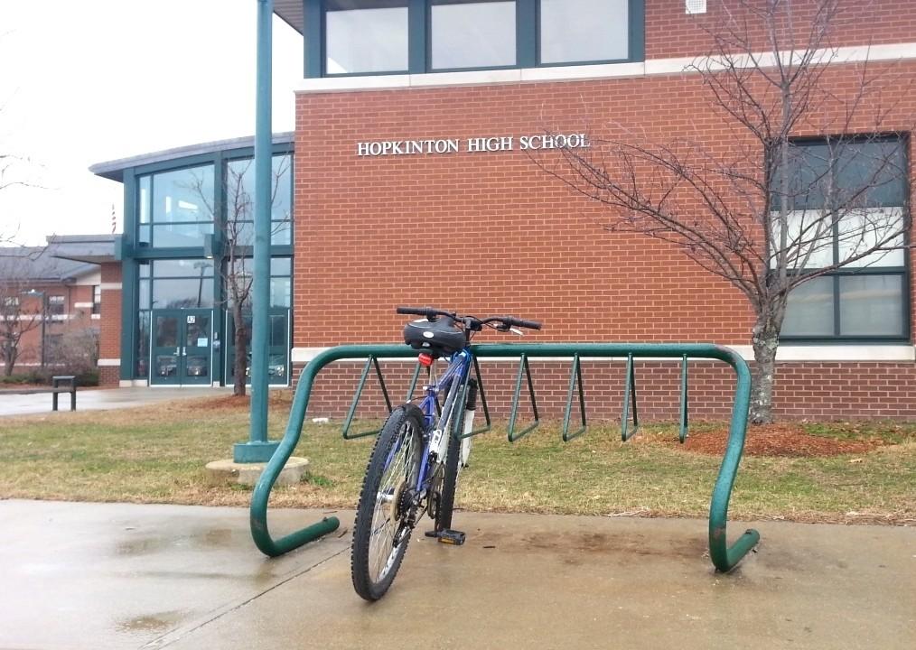A lone bike is locked up outside HHS on a rainy morning. 