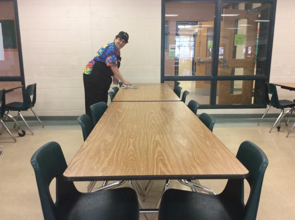 Kathy Bieri cleans a table in between lunches.
