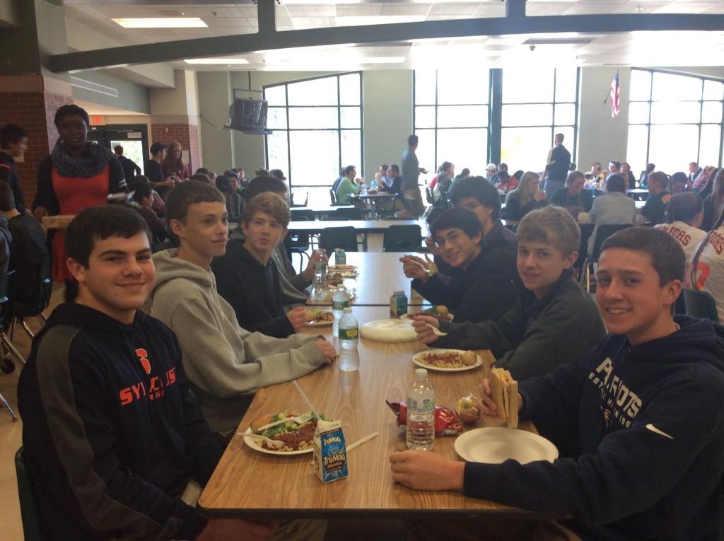 Sophomore students enjoying their lunch in the cafeteria.