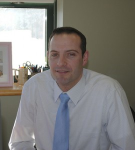 Mr. Bishop working in his office, fulfilling his duties as principal. Photo by Maddie Whittles