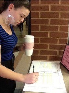 Senior Danielle Hoyt uses senior privileges and signs out of the school during her study. Photo by Sydney Lauro