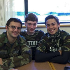 Dan Barra, Tim Greizer, and Brandon Carty represent the Senior Class with their camo