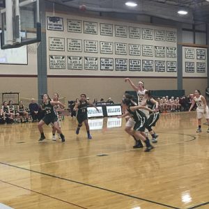 Senior Captain Holly Adams takes the second of two free throws after a hard foul under the basket. Photo by Jillian Sullivan.