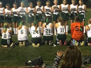 Underclassmen singing a song they wrote to the Seniors before the game. Photo by Casey Palmer.