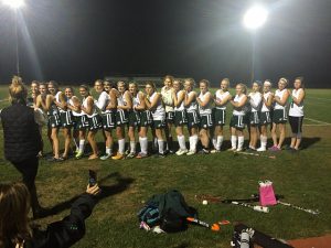 Field hockey lines up after the game to celebrate the tie and acceptance into tournament. Photo by Casey Palmer.