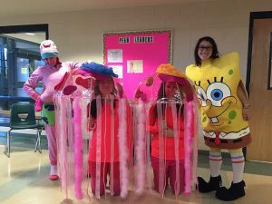 Seniors (from left to right) Emily Schmidt, Bri Mirabile, Azilee Curl, and Maia Guelfi, dress up as characters from Spongebob for senior Halloween. Photo by Veronica Lee. 