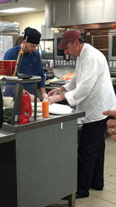 Guest Chef Ryan Harley serves sushi to students. Photo by Casey Palmer. 