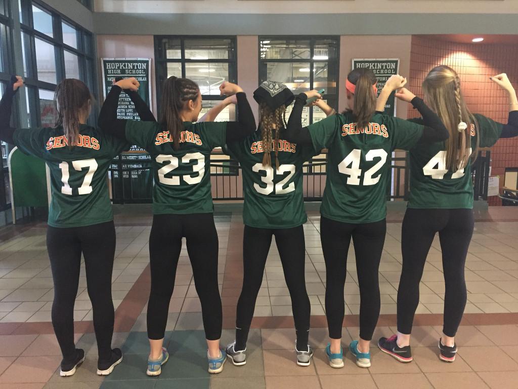 Senior girls Abby Wilson, Kylie Salyards, Marisa Nagel, Emma Zack, and Anna Bullock (left to right) show off their strength on the day of the game. Photo by Casey Palmer.