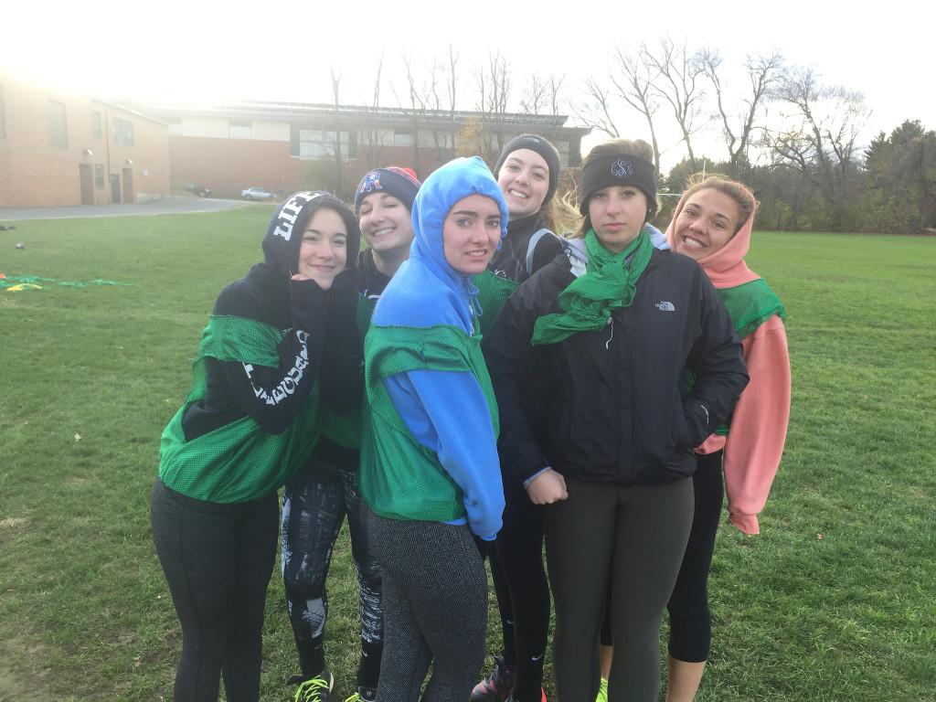 Senior girls practice in the cold and rain for the big game on Friday. Photo by Casey Palmer.