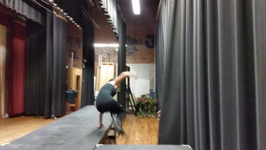 Stage manager McKenzie Simmons jumping from the set following one of the showâ€™s quick set changes.