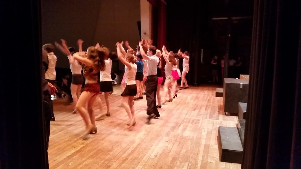 The cast performing the opening dance number at the final rehearsal.