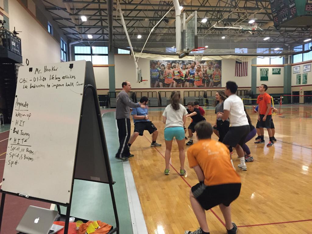 The whiteboard reads the objective of that day's class, "Utilize lifelong activities like badminton to improve health and fitness." This emphasizes the course's ability to relate to real life. Photo by: Julia Joshi and Brittany Power