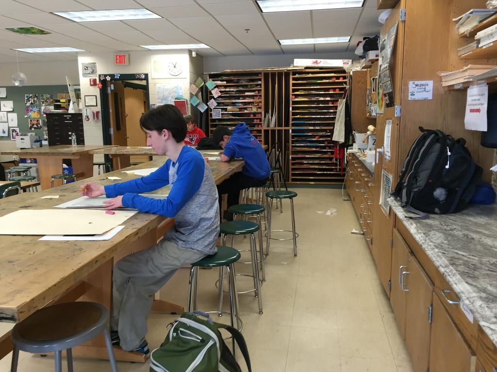 Freshman students work on their self portrait projects in Studio Art 1. Photo by Emma Zack.