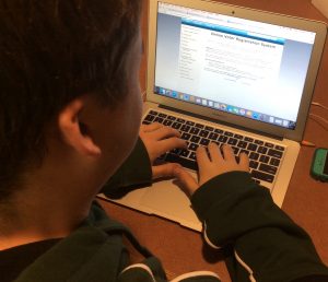 Senior Trevor Perkins filling out the online voter registration form. Photo by Owen McNamara