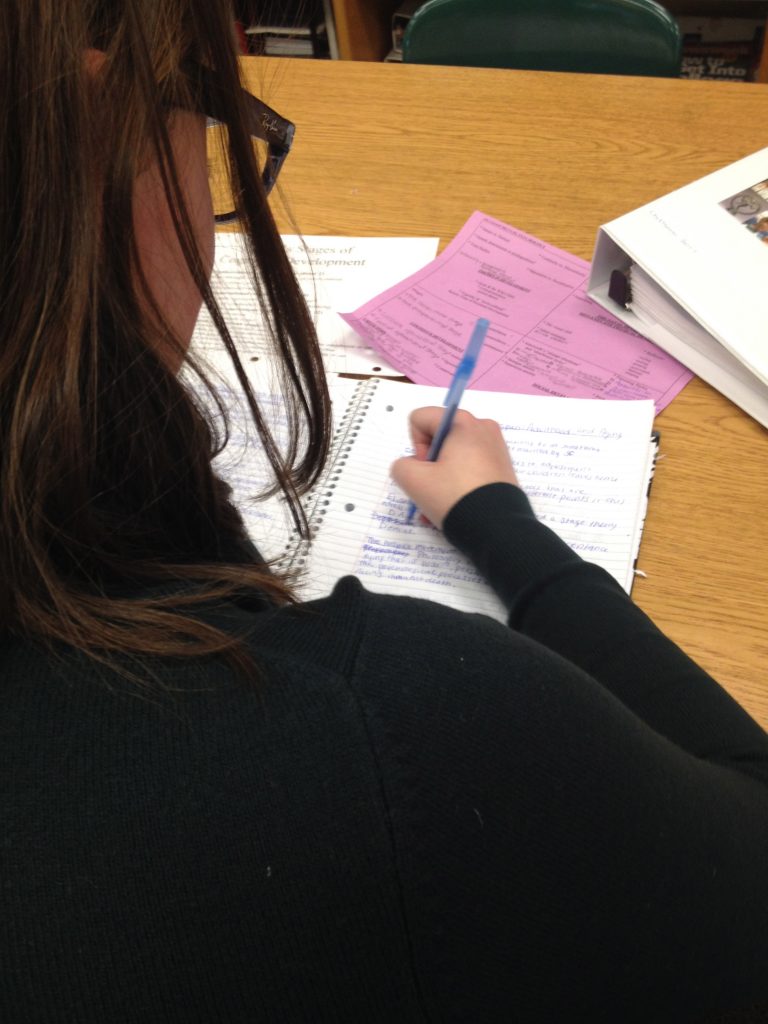 Chryssanthi Barris, senior, studies for her AP Psychology final by rewriting her notes. 