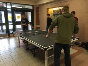 A group of HHS boys playing ping pong outside of the cafeteria during De-Stress Week. Photo By Amanda Sayegh