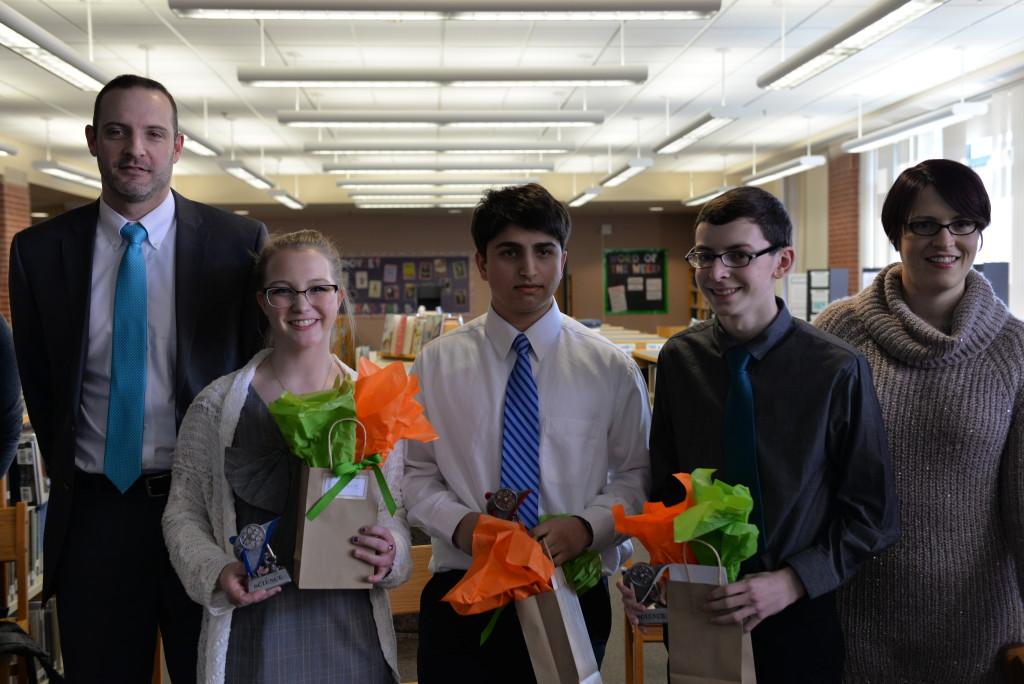 Principal Evan Bishop (left) and science fair advisor Devon Grilly (right) pose with the winners of the 2016 HHS Science Fair, sophomores Freya Proudman and Himanshu Minocha and junior Brian Best. Photo courtesy of Fred Haas.