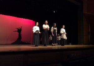 (From Left) Kyla Atwell, Helen Aghababian, Colleen Malloy, and Elizabeth Barnes performing together in "Spoon River Anthology" in the high school auditorium during the Friday show. Photo by Josh Normandeau