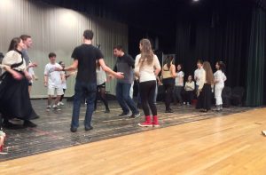 The cast of "Spoon River Anthology" continuously practices the square dance during tech week to perfect the number. Photo by Josh Normandeau