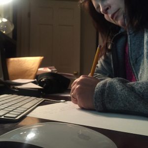 Hopkinton mother Gina Fajardo writing a dismissal note for her daughter. Photo by Michael Fajardo.
