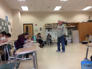 AP Language and Composition teacher, Michael Franchock, reviews a multiple choice activity with his class of 27 juniors. 